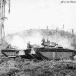Soldiers atop LVTs in action at Hill 120 on Leyte