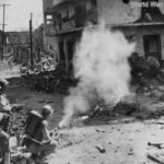 Troops of the 37th Division use flamethrower to blast a Japanese pillbox in the Ermita District of Manila