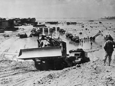 7th AAF Engineers trucks dozer on Saipan Beach