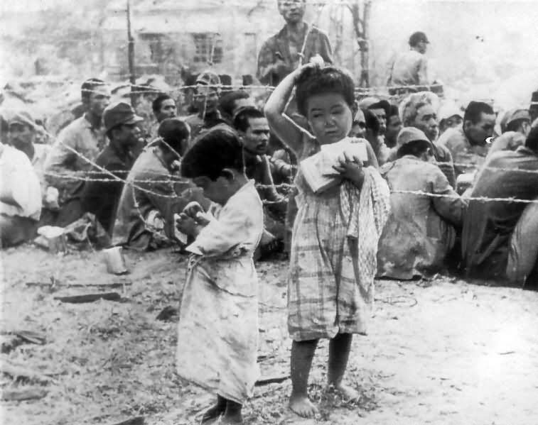 American troops give candy to japanese children Saipan