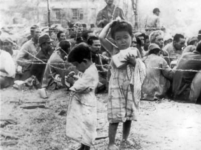American troops give candy to japanese children Saipan