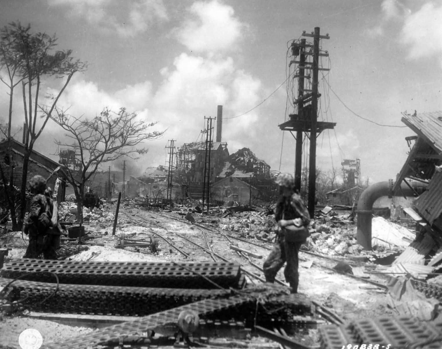 GI’s at wreckage of Japanese sugar mill Saipan