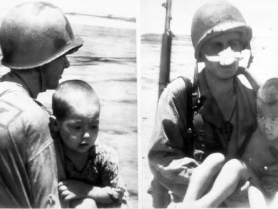 GI’s help carry Japanese kids to safety July 4, 1944 Saipan