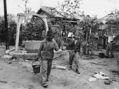 Japanese Work Detail Hauling Water at POW Stockade on Saipan