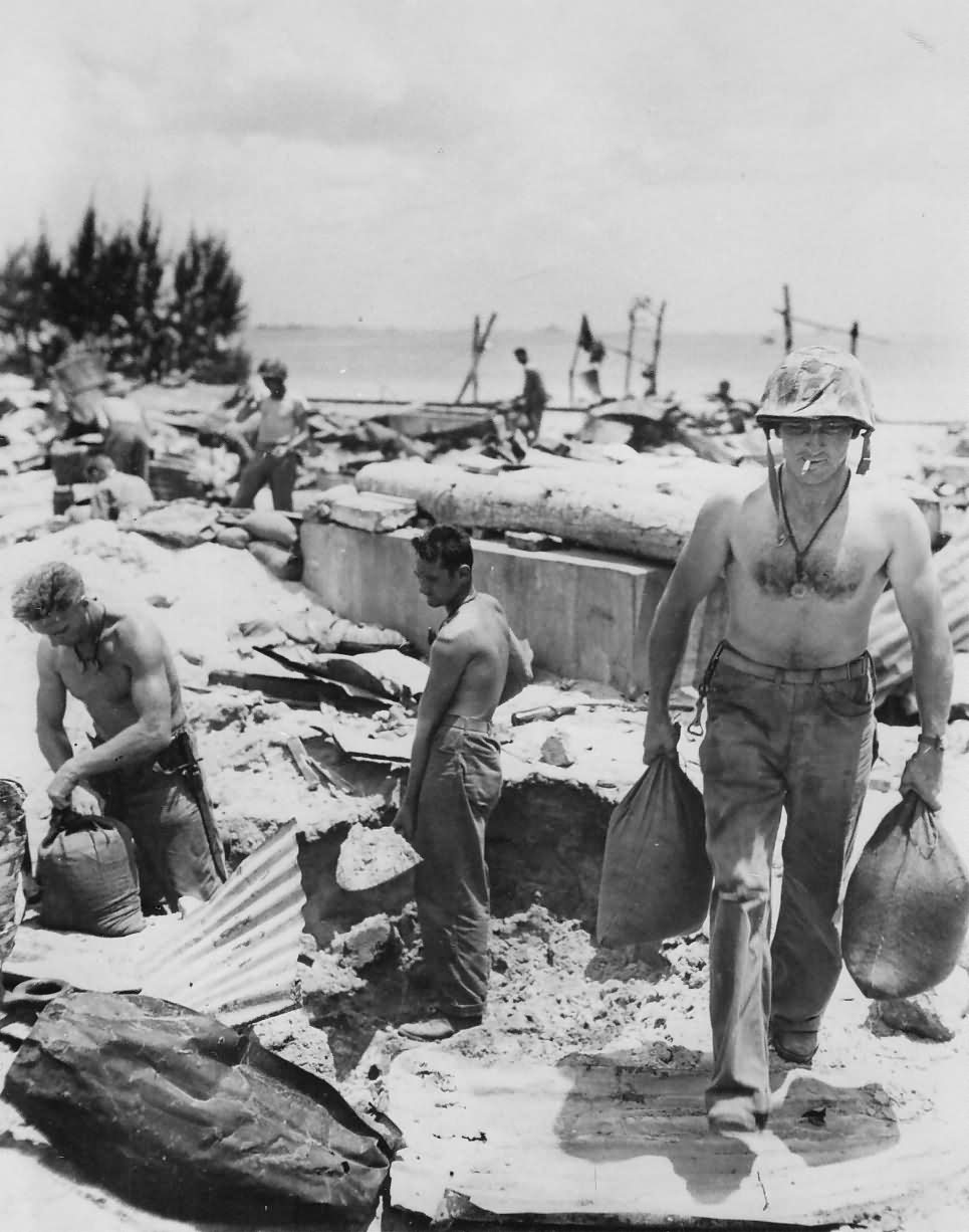 Marine sandbags his foxhole Saipan 1944