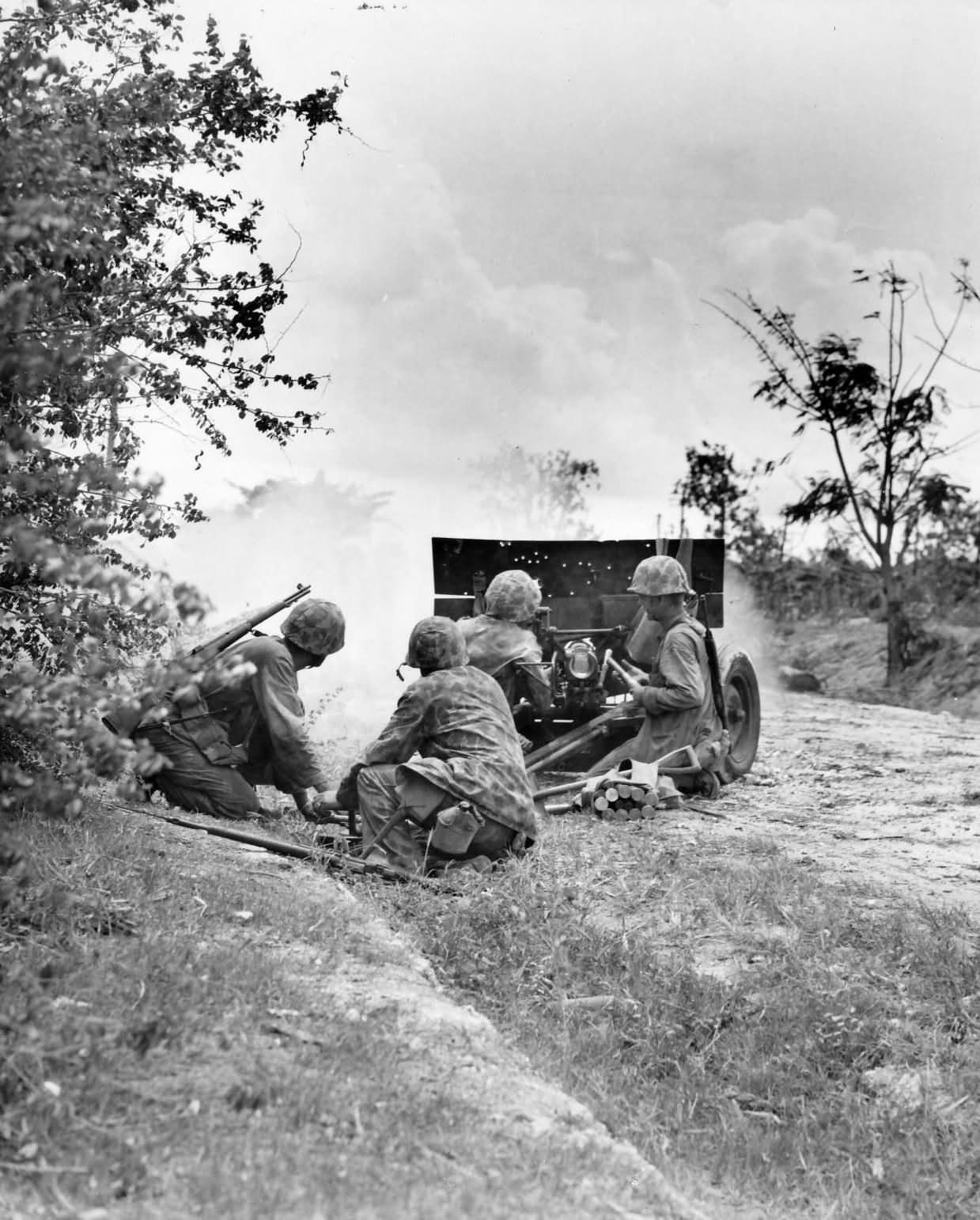 Marines firing 37mm M3 anti tank gun Saipan