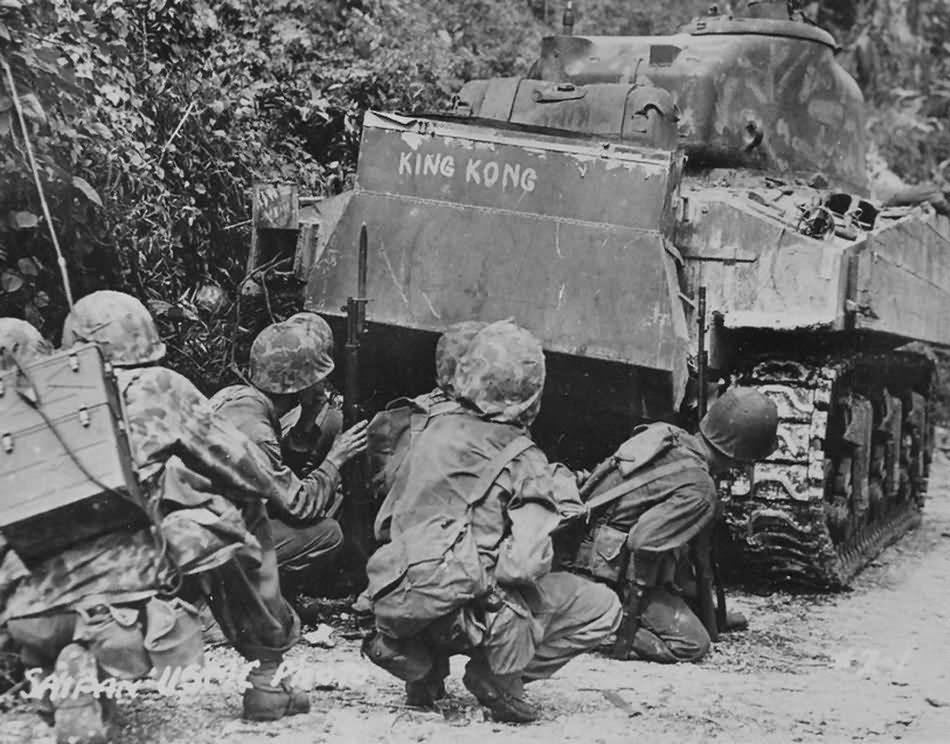 Marines take cover behind a M4A2 named King Kong Saipan 1944
