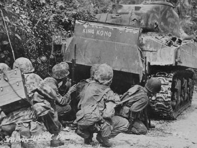 Marines take cover behind a M4A2 named King Kong Saipan 1944