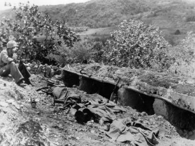 Wounded marine guards poncho covered bodies buddies Saipan 1944