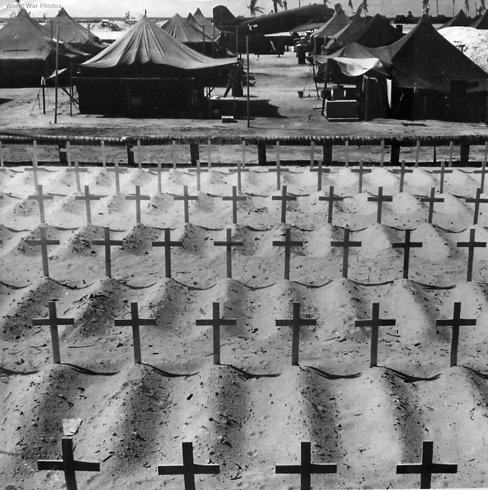 Cross topped graves of U.S. Marines beside camp on Tarawa 1944