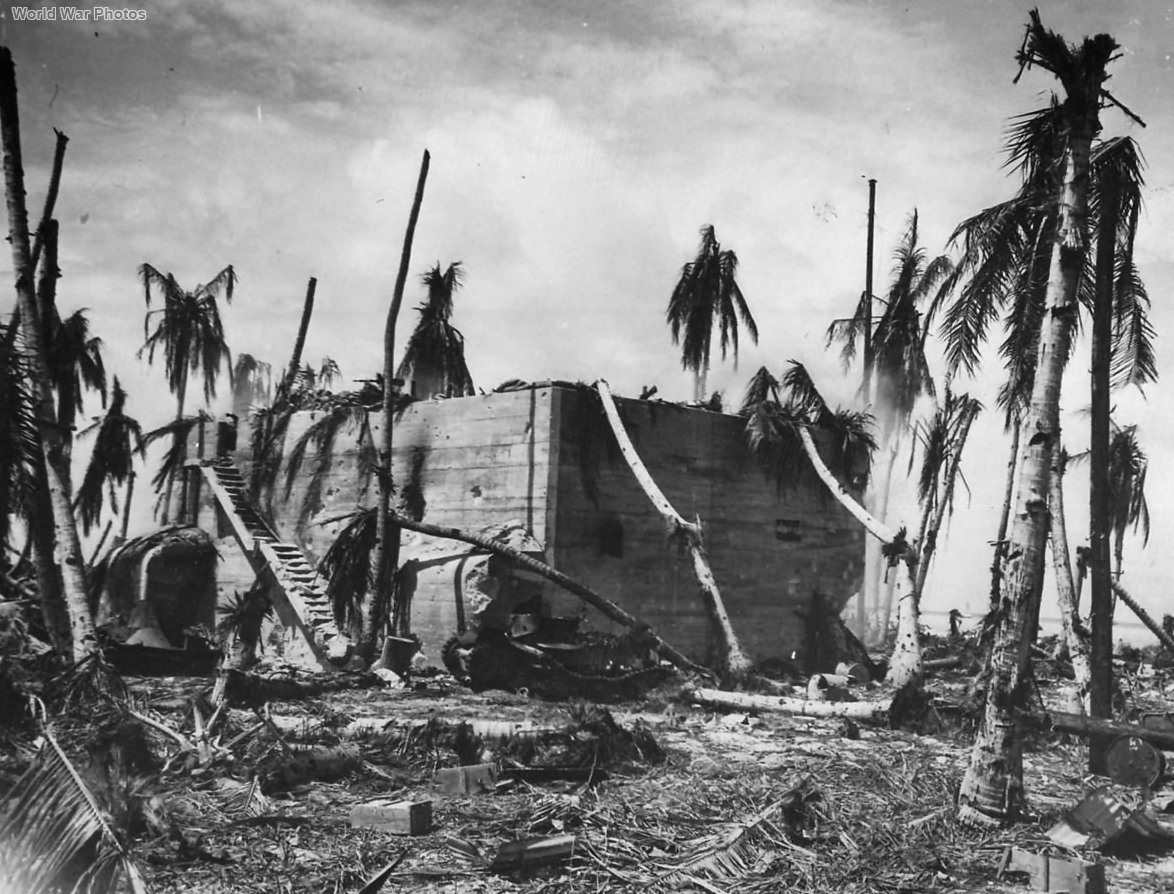 Knocked-out Type 95 Ha-Go tank in front of the Japanese command post off Red Beach 3 on Tarawa