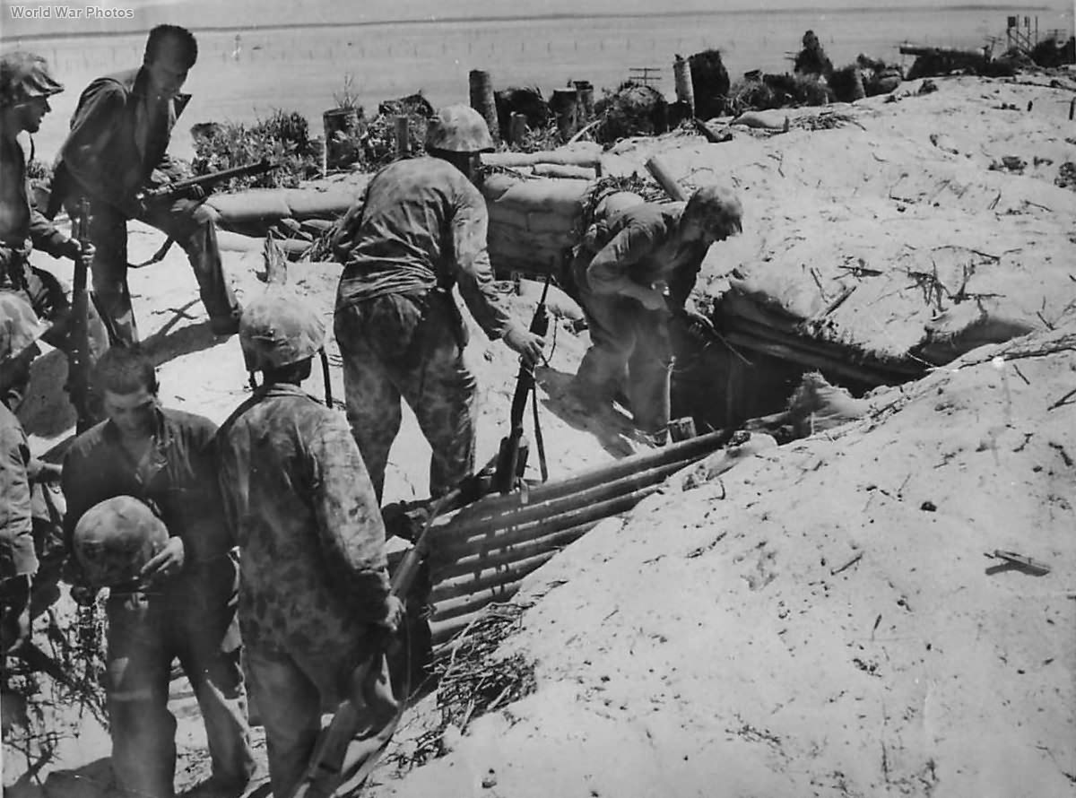 Marines approach Japanese bomb proof shelter on Tarawa