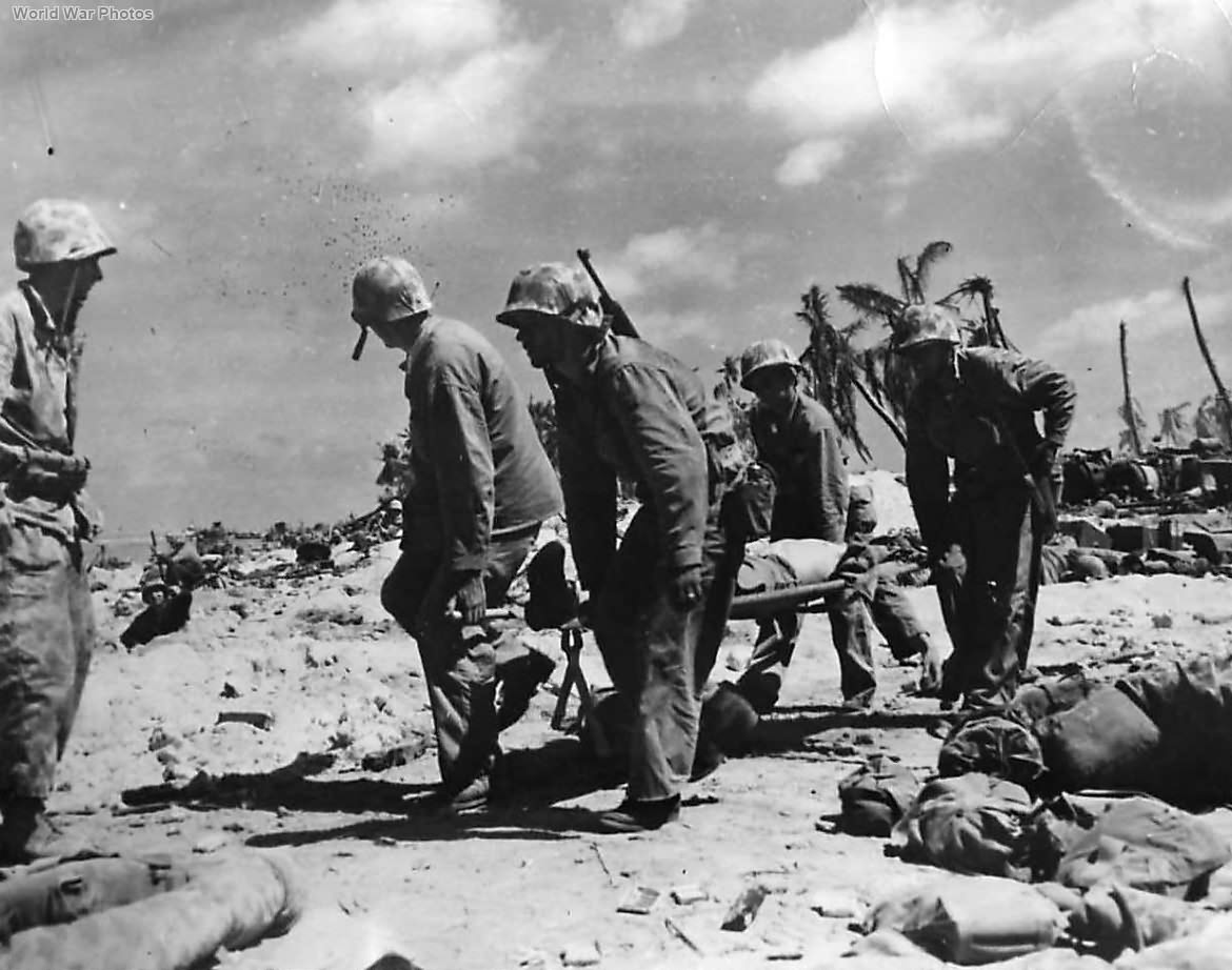 Marines carry wounded buddy to dressing station on Tarawa