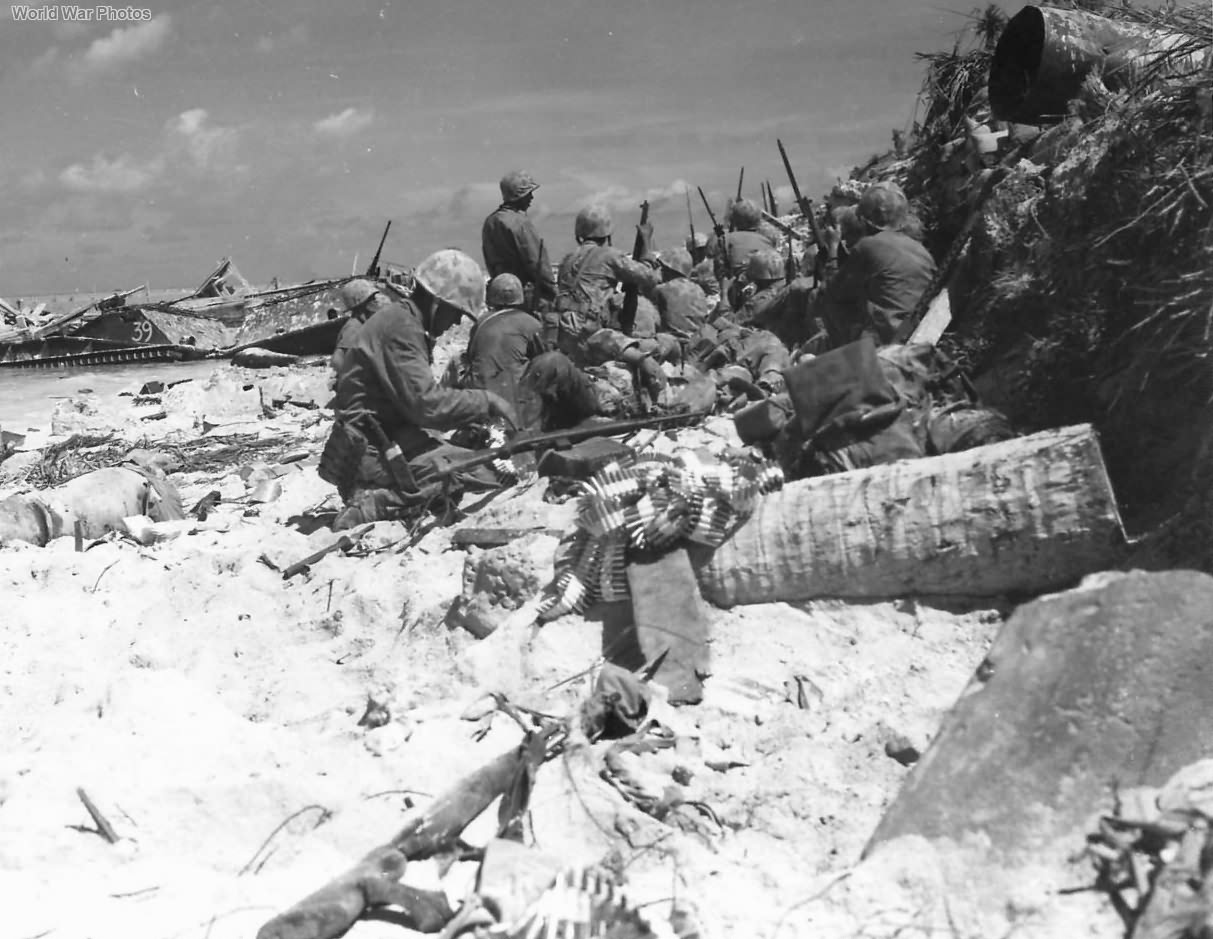 Marines on Red Beach 3 advancing to burns Phillips Pier Tarawa