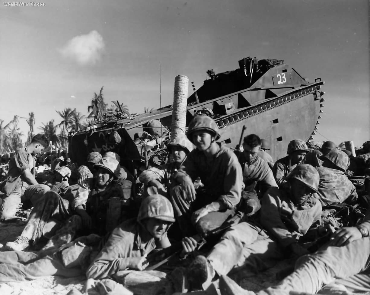 Marines resting by LVT 23 on Red Beach 3 at Tarawa