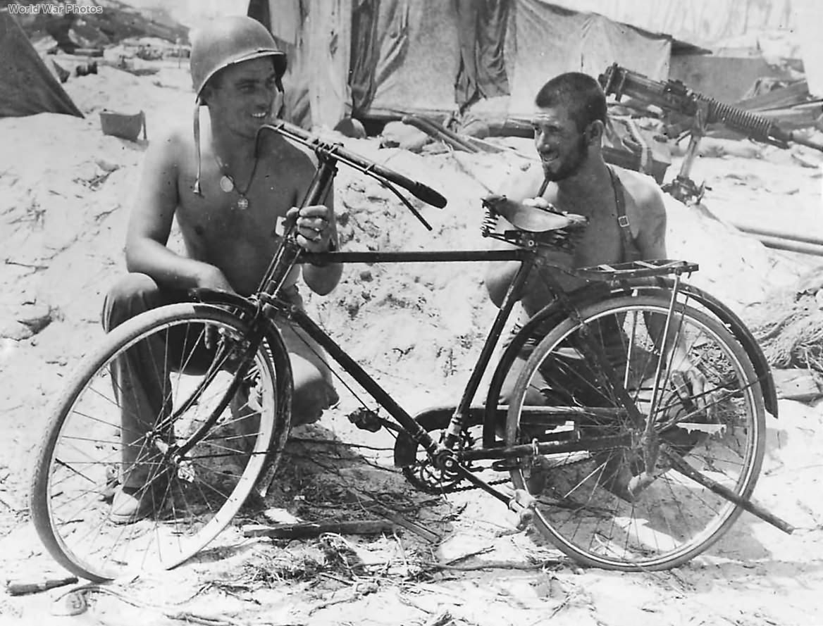 Marines with captured Japanese bicycle on Tarawa