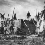 Knocked-out Type 95 Ha-Go tank in front of the Japanese command post off Red Beach 3 on Tarawa