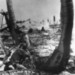 Marine firing on Japanese pillbox on Tarawa