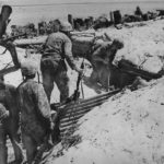 Marines approach Japanese bomb proof shelter on Tarawa