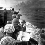 Marines with Pin-Up girl picture in Landing Craft off Tarawa