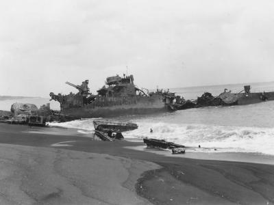 Destroyer and LVT Amtrac Wrecks Landing Craft On Tinian Beach