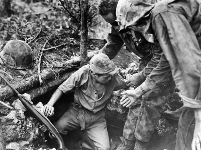 Marines Coax Japanese Soldier from Dugout on Tinian