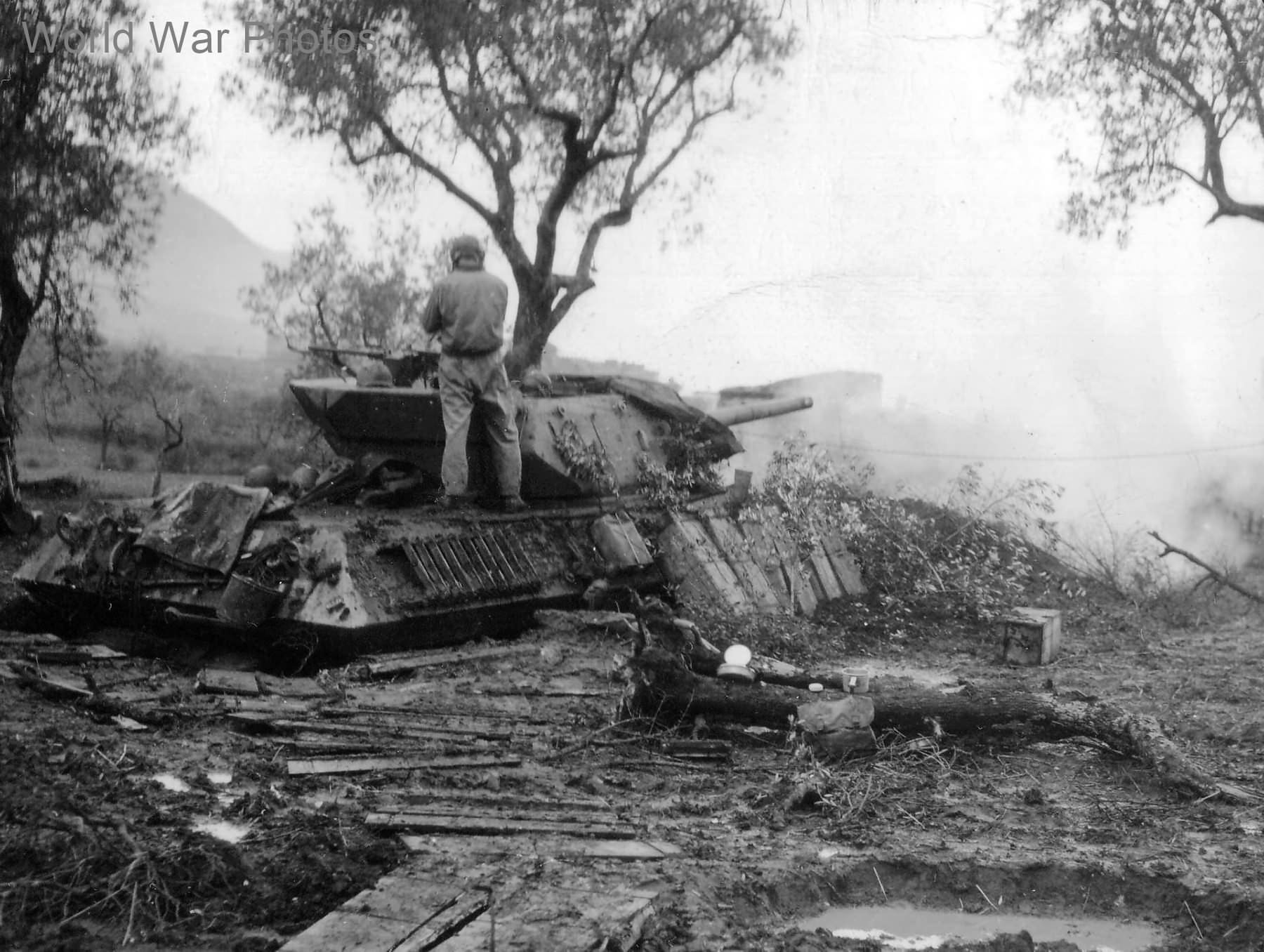 Dug in American tank destroyer M10 firing as artillery against Germans