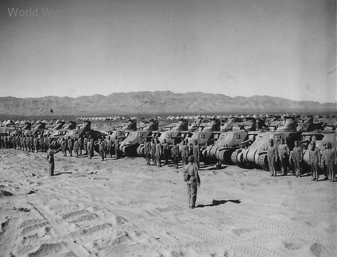 Crews lined up by M3 Lee tanks at Indio, California Desert Training Center 1942