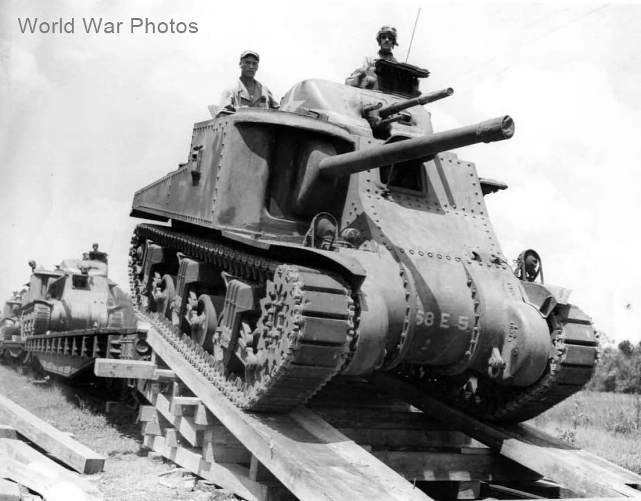Unloading a Medium Tank, M3 from a train car, USA