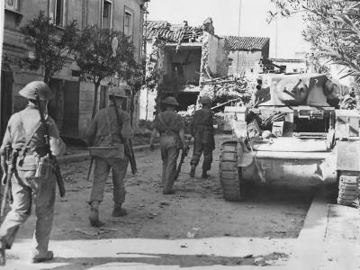 British troops advance past KO’d M3 in Grazzanise Italy 1943