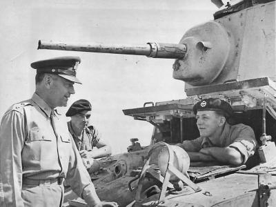 Gen. Russell Maxwell chats with British Driver 1942