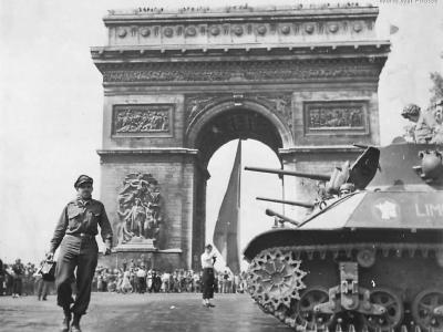 Photographer Bert Brant passing M3A3 in Paris