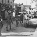 British troops advance past KO’d M3 in Grazzanise Italy 1943