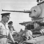 Gen. Russell Maxwell chats with British Driver 1942