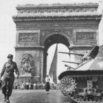 Photographer Bert Brant passing M3A3 in Paris