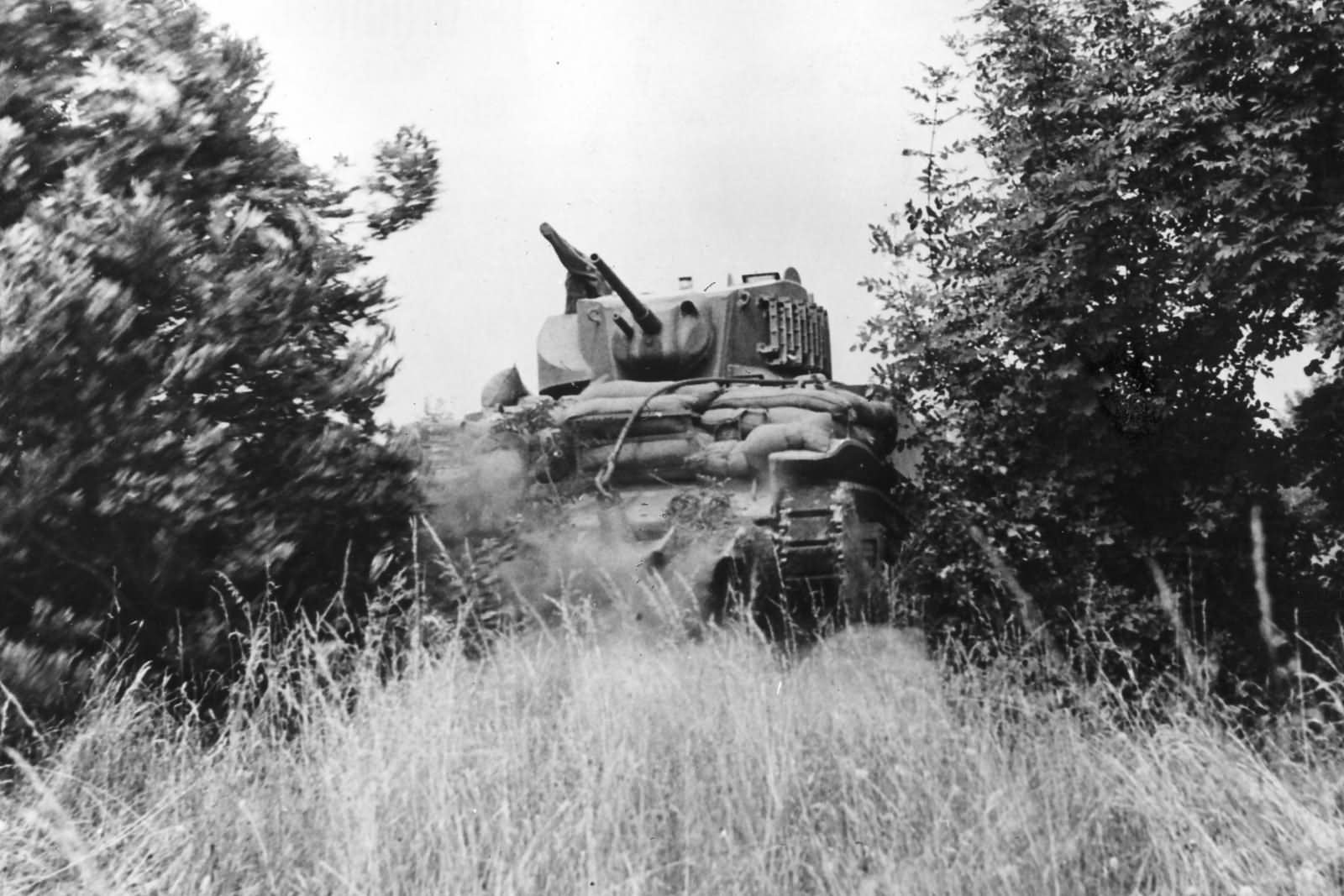 M5 Stuart tank hedgerow busting in Normandy 1944