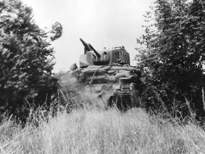 M5 Stuart tank hedgerow busting in Normandy 1944