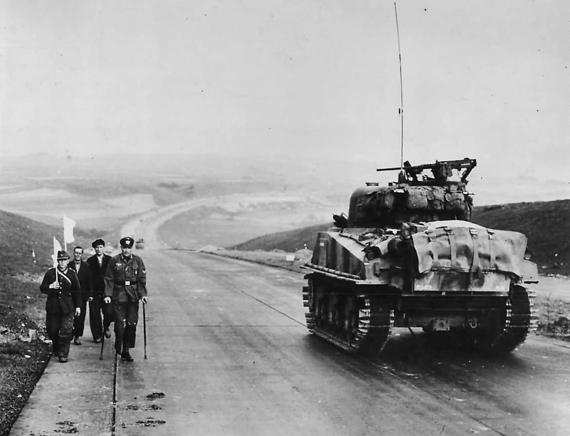 1st Army M4 Sherman Tank Passes Surrendering Germans at Kassel 1945