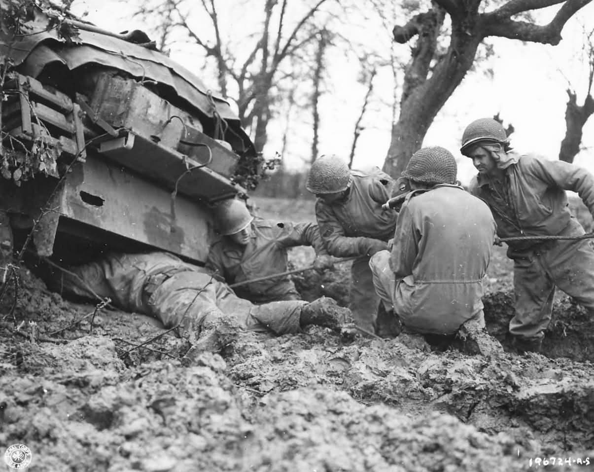 9th Army Troops Rescue M4 Sherman Tank from Mud 1944