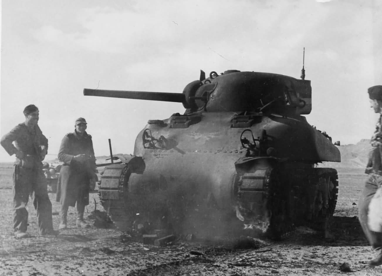Destroyed M4A1 Sherman tank and Afrika Korps troops Tunisia