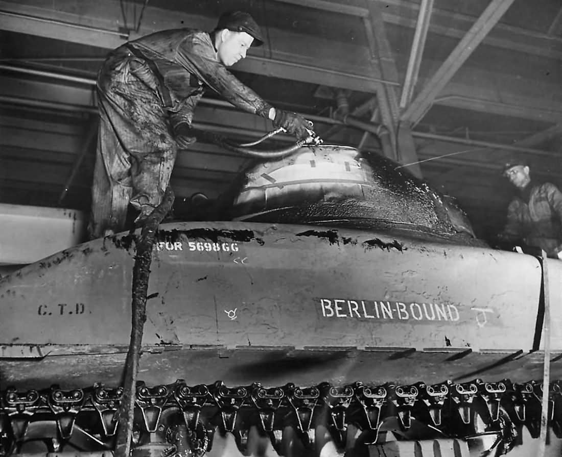Workmen give final coat of paint to M4 Sherman named Berlin Bound at the Chester Tank Depot 1943