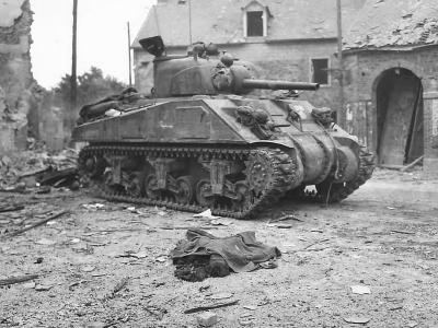 Body of Civilian by US M4 Sherman Tank in Canisy France 1944