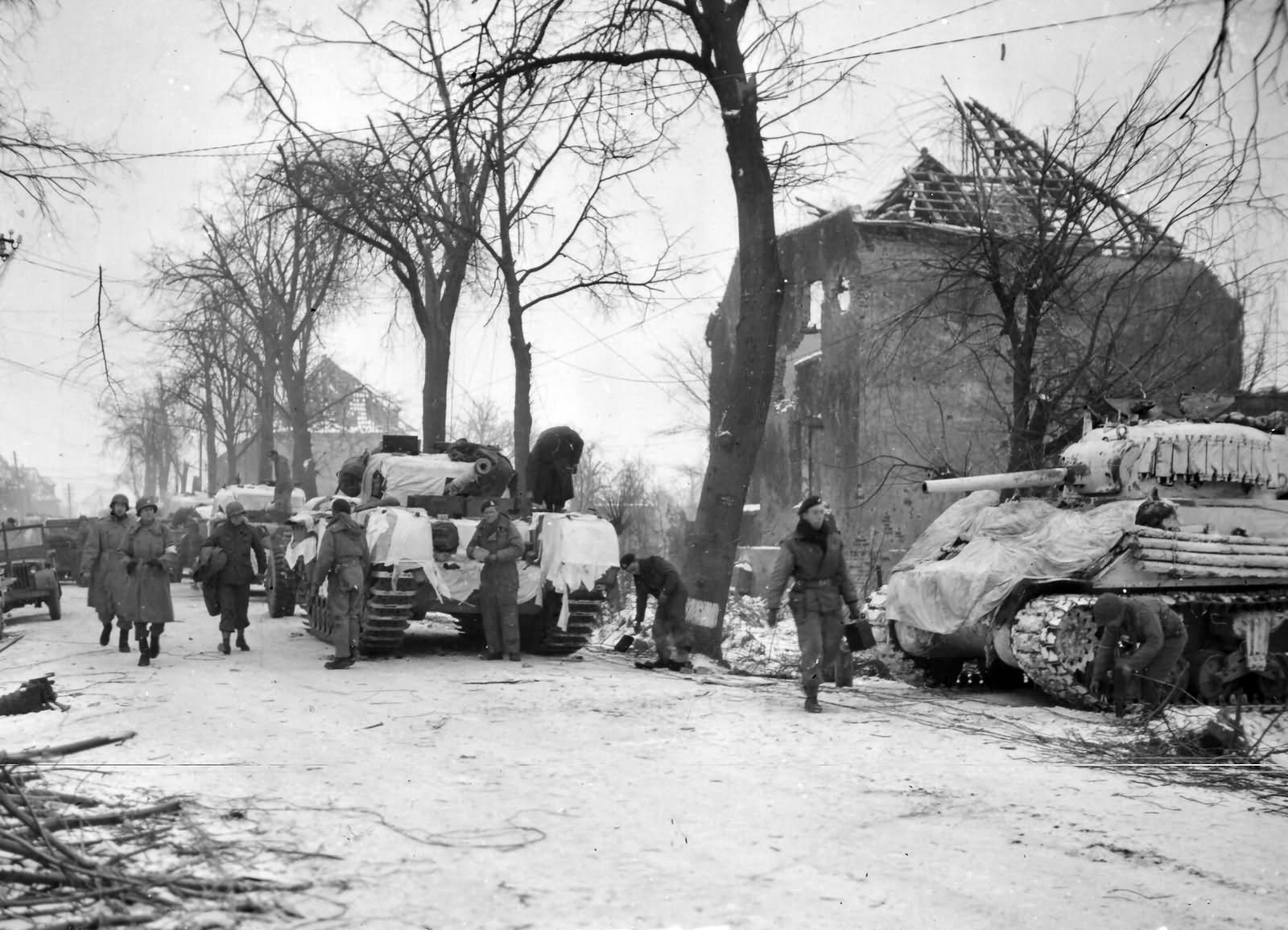 Churchill and M4 tanks in winter camouflage at Lindern Germany 1945