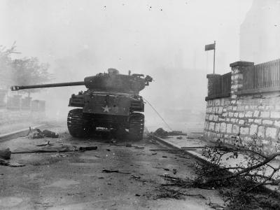 M4 Sherman commanded by SGT Leniar C. Covey of the 748th Tank Battalion in burning Neumarkt.