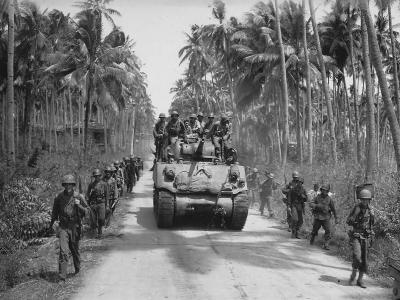US Army 40th Inf GI’s and M4 Shermna tank towards Bago River bridge Negros 1945