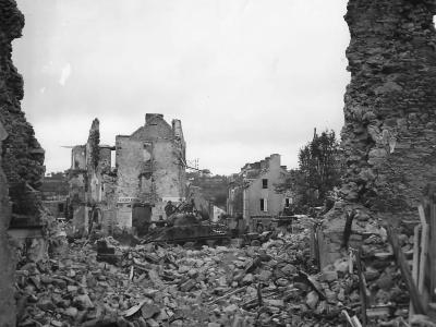 US Troops and M4 Sherman Tank Moving thru Ruins of Coutances 1944