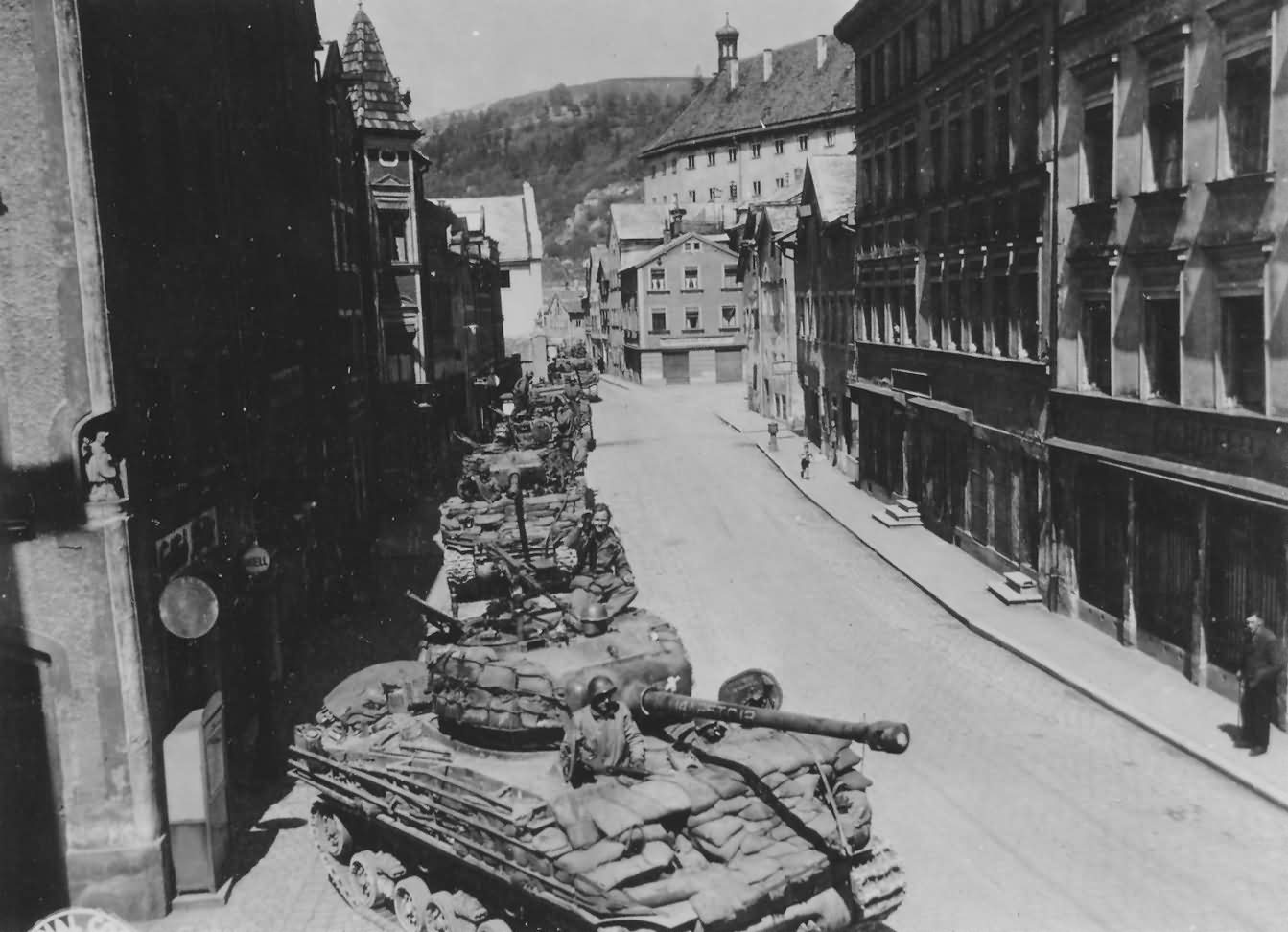 Long row of M4A3(76)W Sherman HVSS tanks enter Eichstatt Germany, 25 April 1945. Shermans of the 25th Tank Battalion, 14th Armored Division