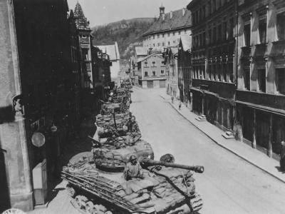 Long row of M4A3(76)W Sherman HVSS tanks enter Eichstatt Germany, 25 April 1945. Shermans of the 25th Tank Battalion, 14th Armored Division
