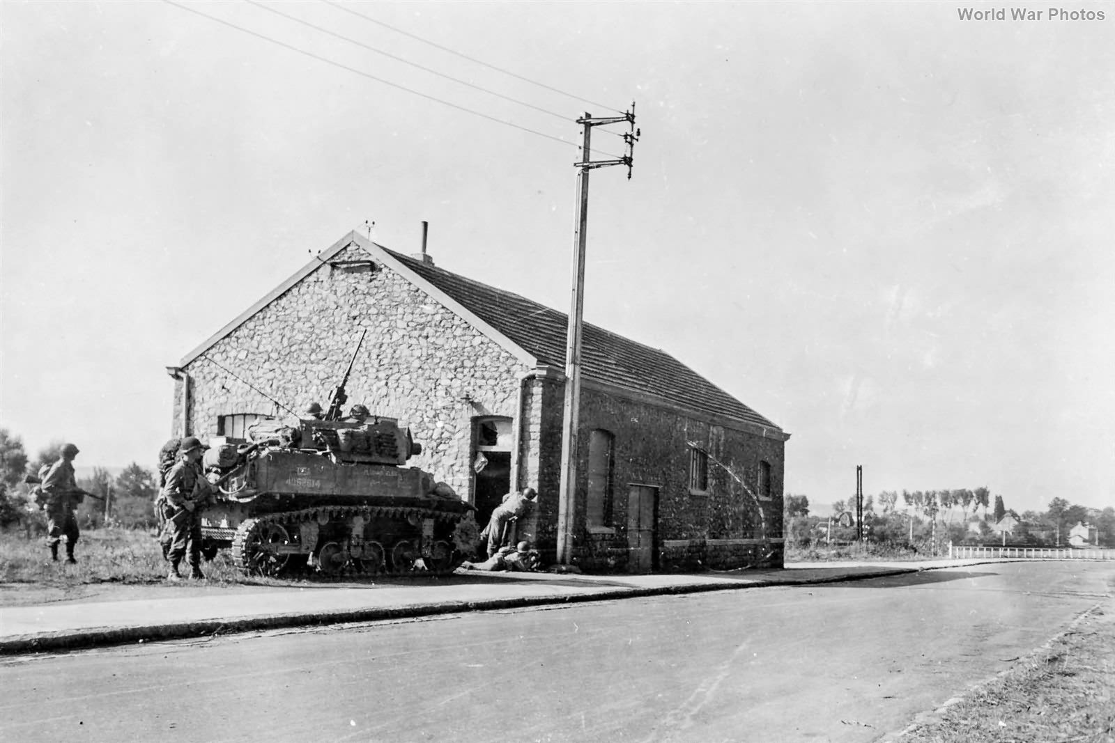 M8 Scott supporting troops from 30th ID, 117th IR Vise Belgium, 11 September 1944