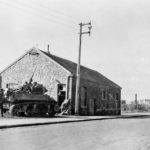 M8 Scott supporting troops from 30th ID, 117th IR Vise Belgium, 11 September 1944